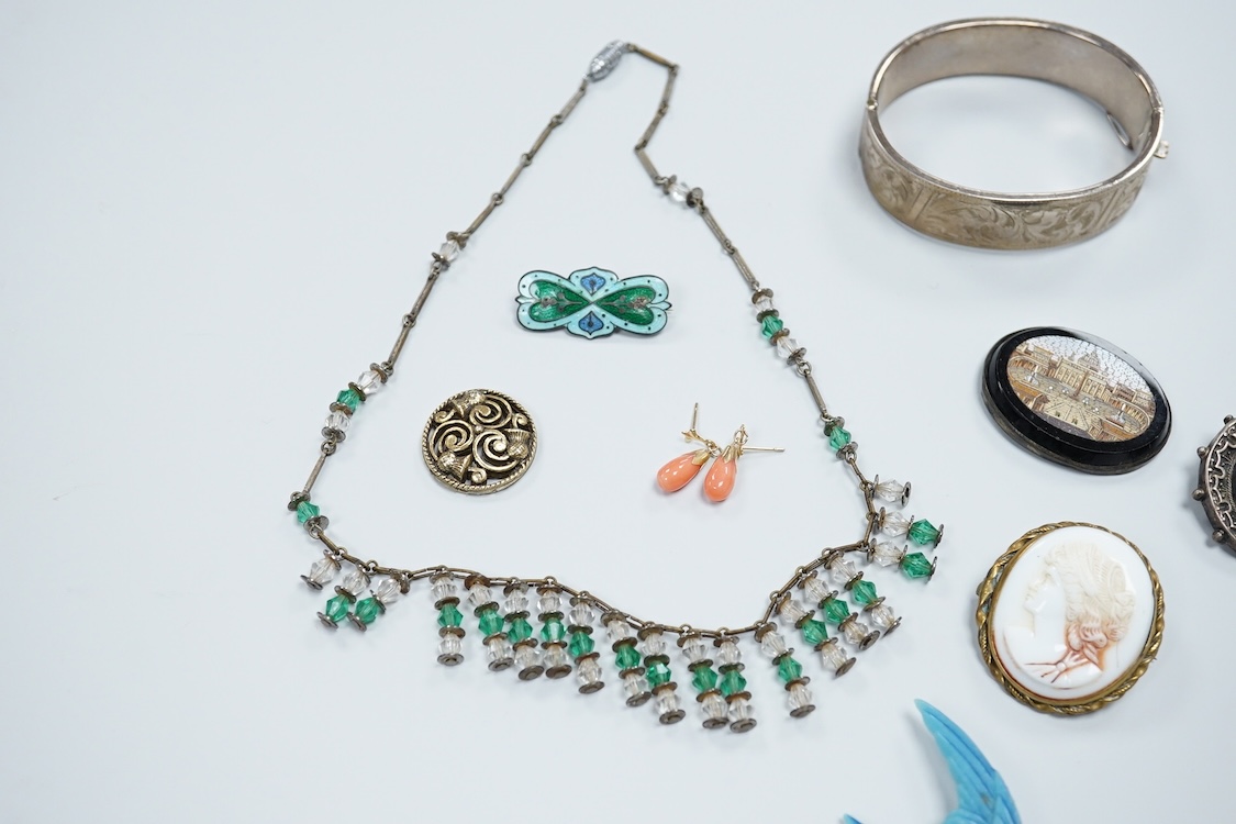 A group of mainly antique jewellery including micro-mosaic plaque, a pair of 9ct and coral drop earrings, a silver bangle, a George V enamel and silver brooch(a.f.) etc.